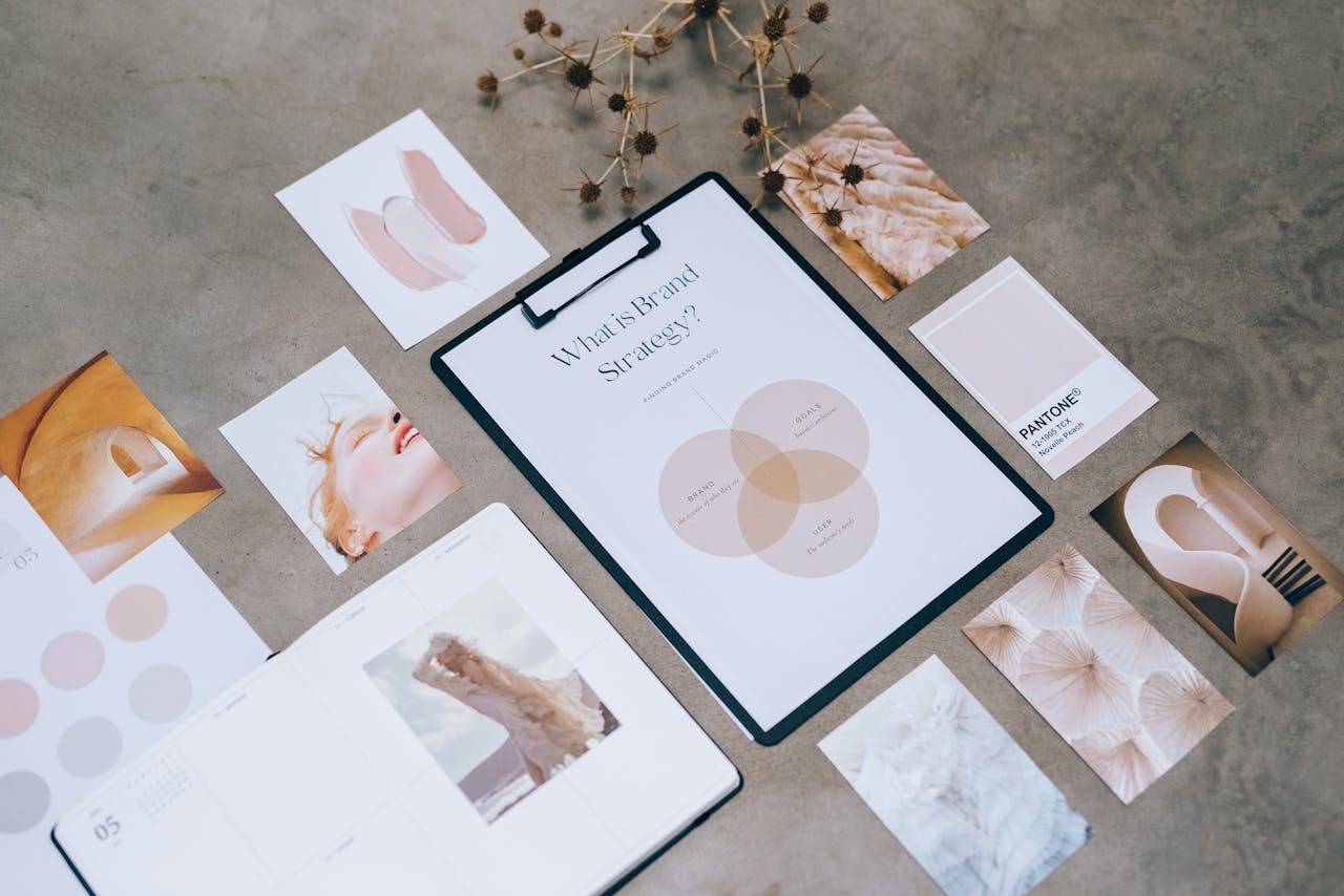 about-us Flat lay of a minimalist brand strategy moodboard on a concrete surface.